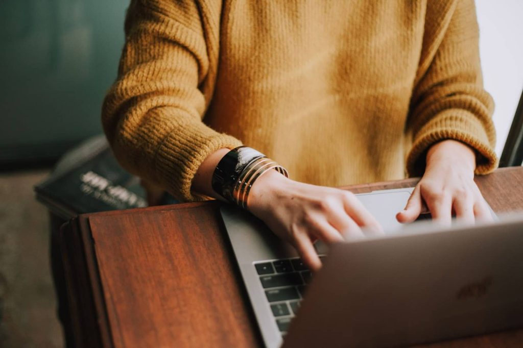 Cropped image of a person using a laptop to research a new career.